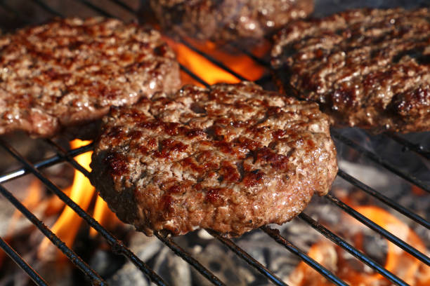 istock Beef burger for hamburger on barbecue flame grill 1064573678