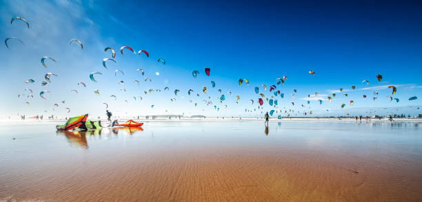 Kite surfing Kite surfing at Essaouira Beach, Morocco kiteboarding stock pictures, royalty-free photos & images