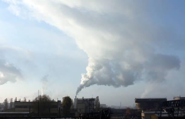 istock Industrial plant against cloudy sky 1064576150