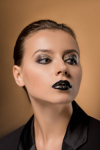 istock young beautiful woman with glittery makeup 1064576284