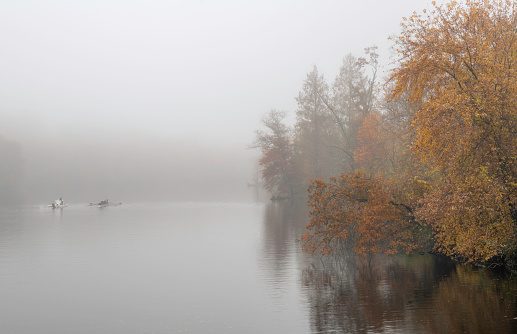 Fogy mystical morning on the lake at Princeton, New Jersey featuring autumn colors and dreamy mood