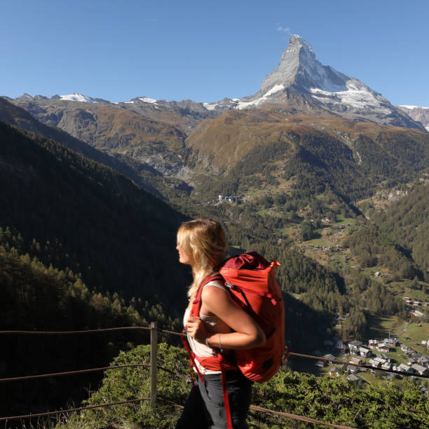 istock Female hiker looks at view 1064576834