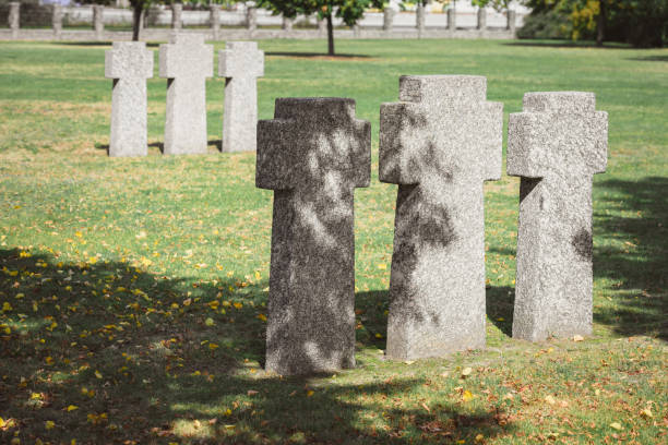 istock selective focus of identical gravestones placed in rows at graveyard 1064578806