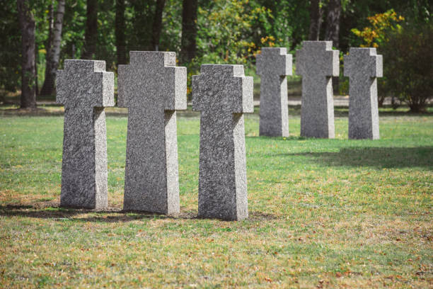 istock selective focus of identical gravestones placed in rows at graveyard 1064578834