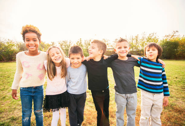 istock Happy kids running on meadow 1064578842