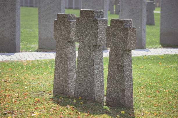 istock selective focus of identical old memorial headstones placed in row at cemetery 1064578944