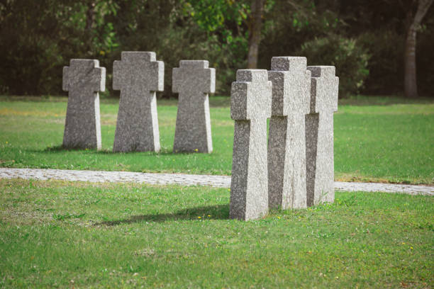 istock cemetery with identical old memorial headstones placed in rows 1064579026