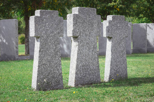 istock selective focus of memorial stone crosses placed in row at graveyard 1064579070