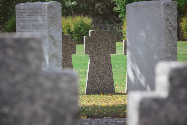 istock selective focus of memorial stone crosses placed in row at cemetery 1064579074