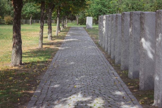 istock path from paving stone and memorial headstones placed in row at cemetery 1064579086