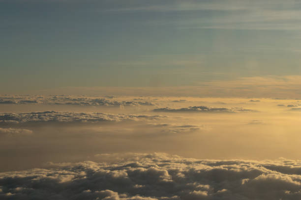 istock Image of Sunrise above the clouds from airplane window, India 1064579180