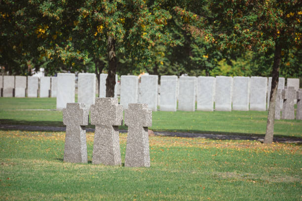istock identical memorial stone crosses placed in row at cemetery 1064579196