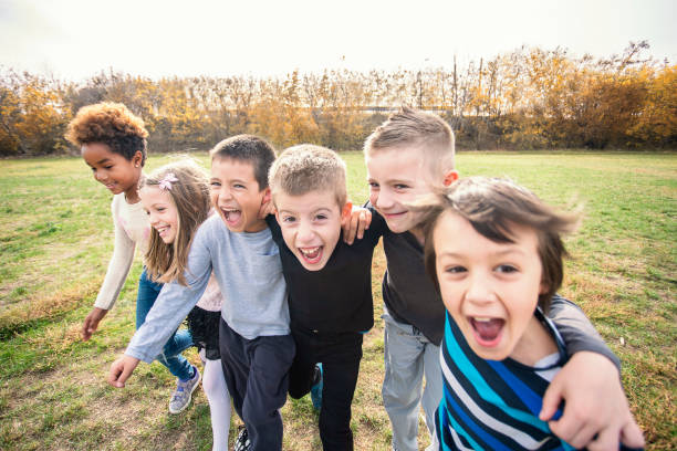 istock Happy kids running on meadow 1064579258