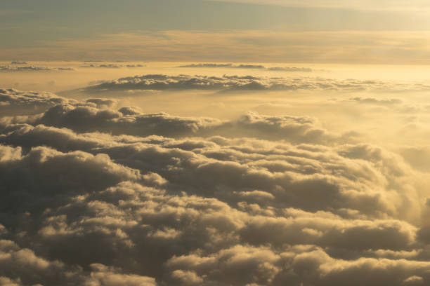 istock Image of Sunrise above the clouds from airplane window, India 1064579426
