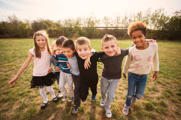 istock Happy kids running on meadow 1064579634