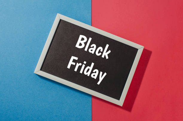 istock Black Friday - text on chalkboard on blue and red background. 1064579696