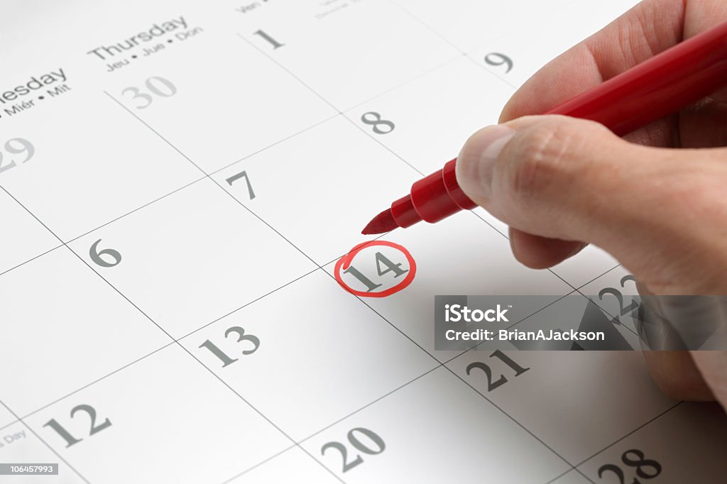 A circled date on a large calendar in red ink Red circle marked on a calendar concept for an important day Calendar Stock Photo