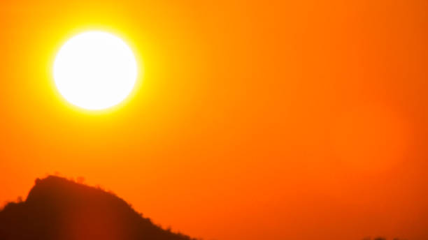 istock Sunset a beautiful sky orange golden clouds 1064580388
