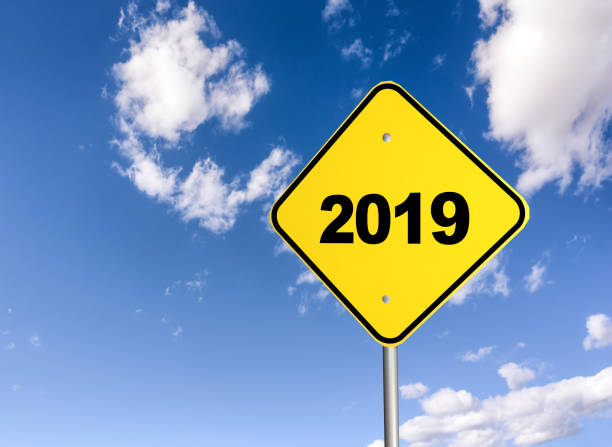 istock road sign 2019 on the blue sky. 3D illustration 1064581688