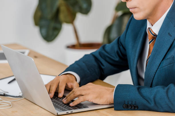 istock adult businessman using laptop in office 1064582890