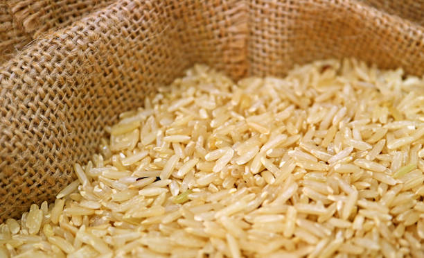 istock Uncooked Thai Brown Jasmine Rice in a Natural Hemp Sack 1064584754