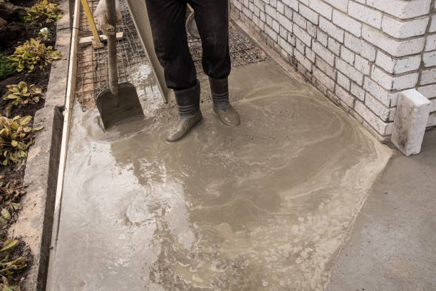 istock equipment and construction of a paving concrete walkway around the house 1064587708