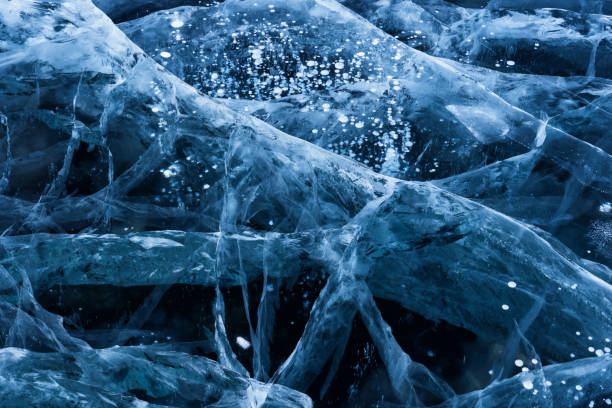 istock Blue cracked surface of the ice surface 1064587910