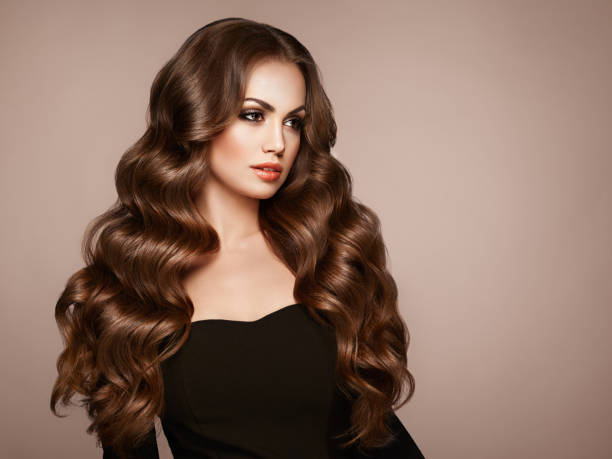 istock Brunette woman with curly hair 1064588172