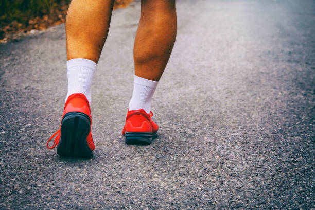 istock Sportsman walking on a road 1064588420