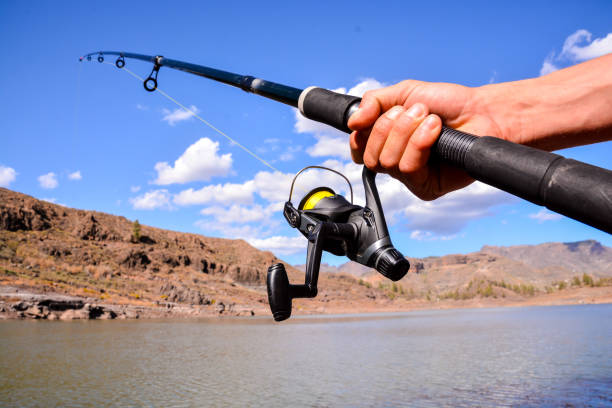 istock Fishing with rod on lake 1064590950