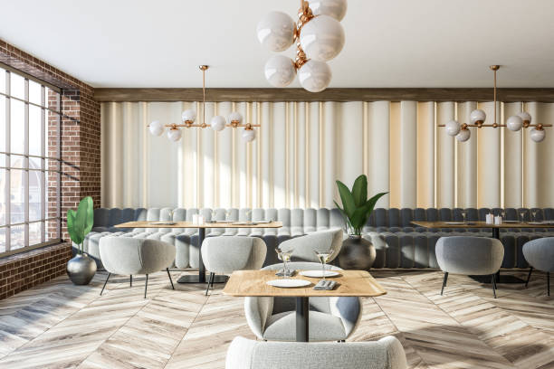istock Brick wall gray sofas and armchairs coffee shop 1064593546