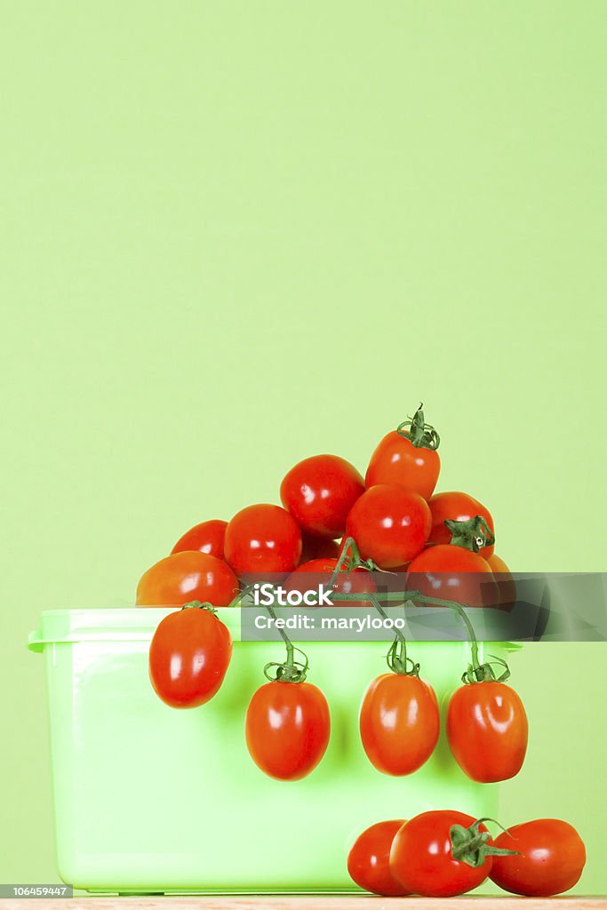 container with fresh tomatoes  Basket Stock Photo