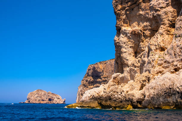 istock Alghero, Sardinia, Italy - Limestone cliffs of the Capo Caccia cape 1064597020