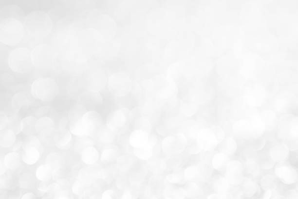 istock abstract background white Silver lights on christmas bokeh 1064597784