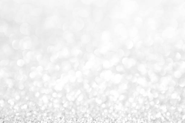 istock abstract background white Silver lights on christmas bokeh 1064597818