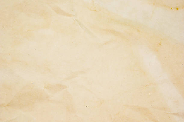 istock rough beige paper grunge background texture for design 1064598758