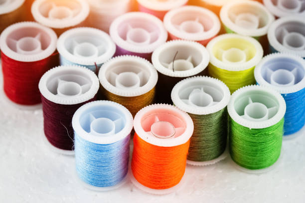 istock The roll of colorful thread on background,needlework,craft,sewing and tailoring concept,warm light tone,blurry light around 1064598938
