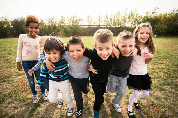 istock Happy kids running on meadow 1064599446