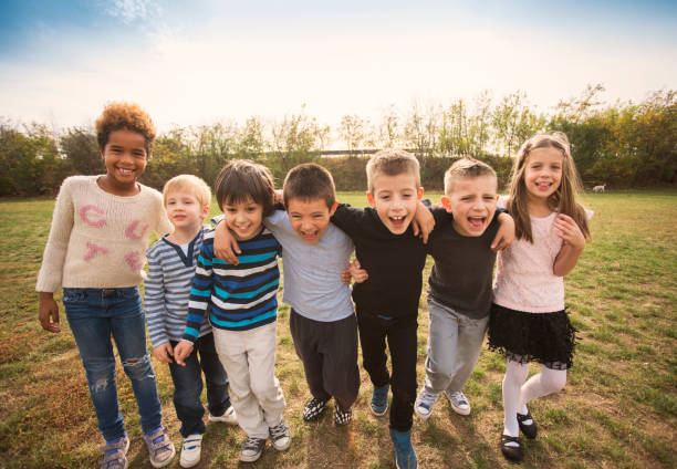 istock Happy kids running on meadow 1064599630