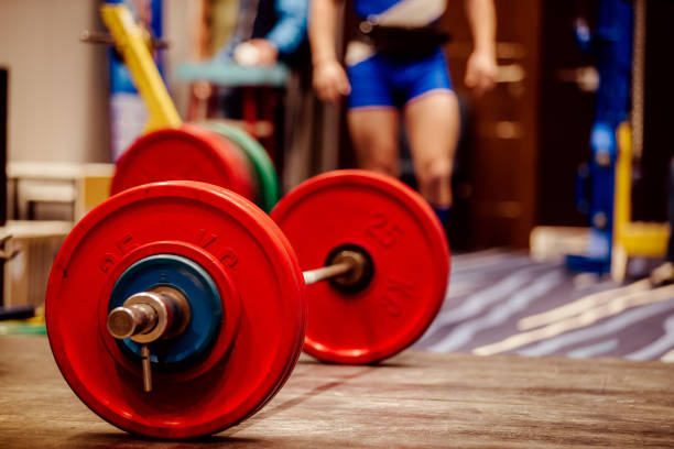 istock barbell red bumper plates on ground for deadlift 1064603680