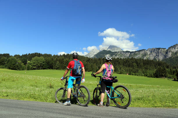 istock Mountain biker enjoying the mountain panorama 1064603736