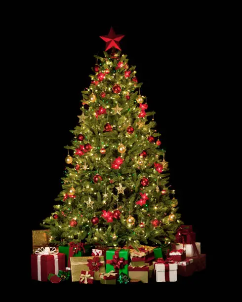 Photo of Christmas Tree with Decorations, Ornaments and Gifts Isolated on Black