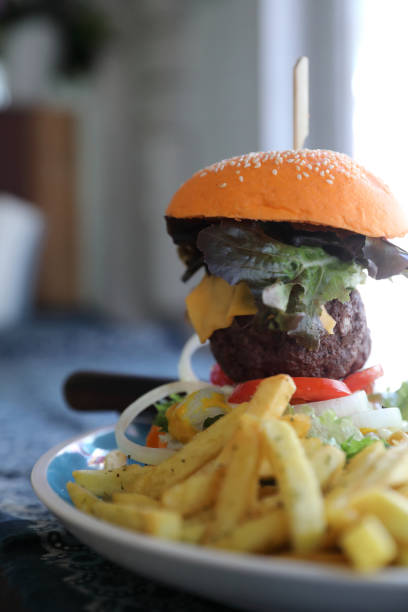 istock Beef hamburger fastfood on wooden table 1064608692