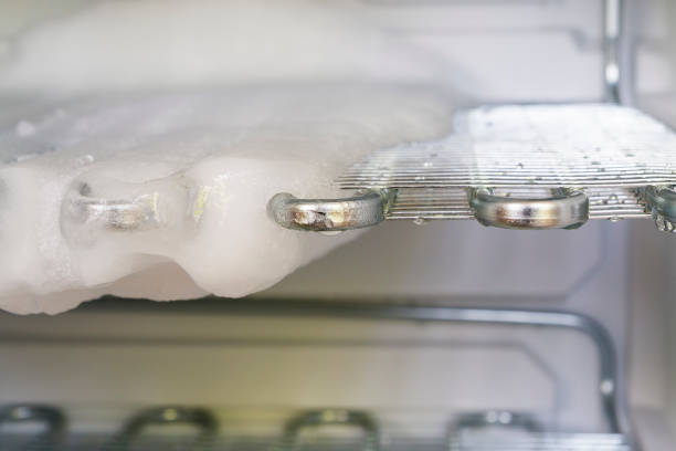 Fridge Look in the freezer while defrosting defrost stock pictures, royalty-free photos & images