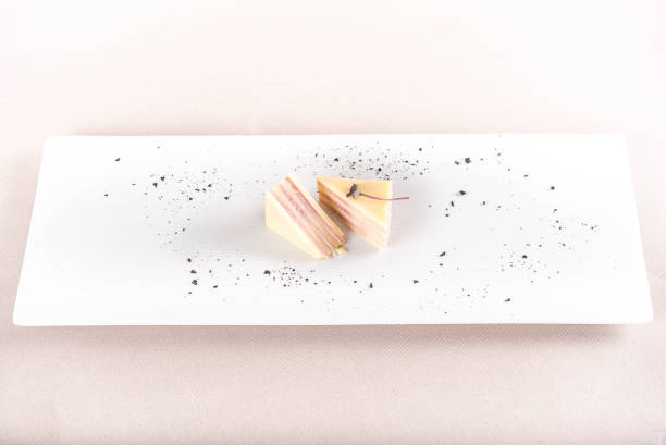 istock Fresh appetizer with ham and cheese,  multiple layers,  decorated with green leaf,  placed on white plate,  light background,  isolated 1064630270