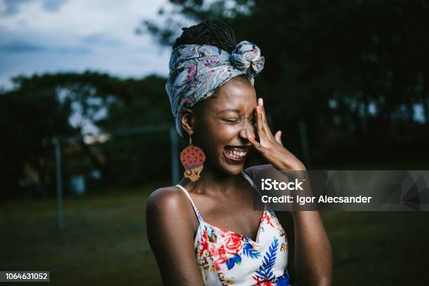 Beautiful Africanamerican Young Woman Stock Photo - Download Image Now - Embarrassment, Teenager, Laughing