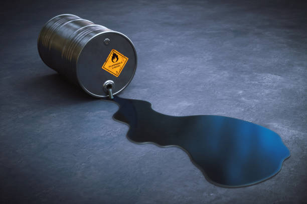 istock Leaking oil barrel spilling gasoline on the ground 1064632088