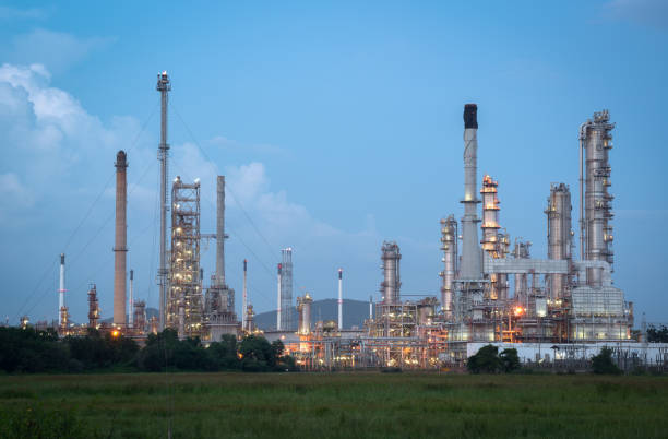istock Oil refinery plant at twilight with blue sky. 1064632928