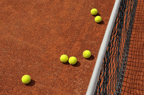 istock Tennis ball on red slag 106463588