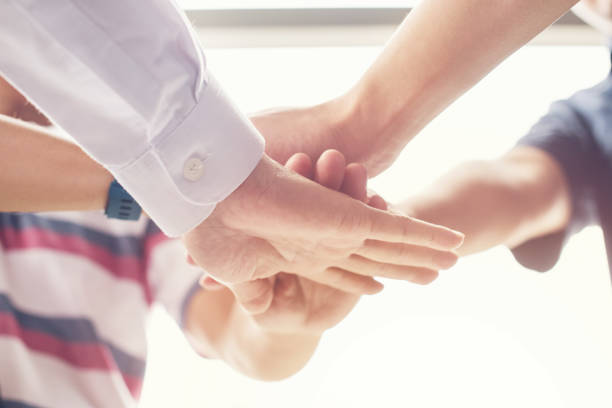 istock together collaborate of hands teamwork in meeting room office 1064642306